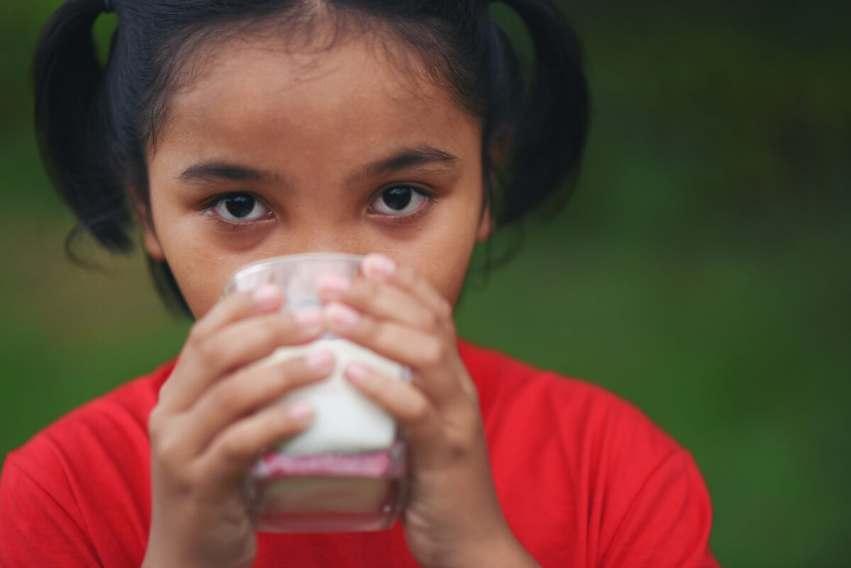 little-girl-drinking-milk-park-1-1200x801.jpg